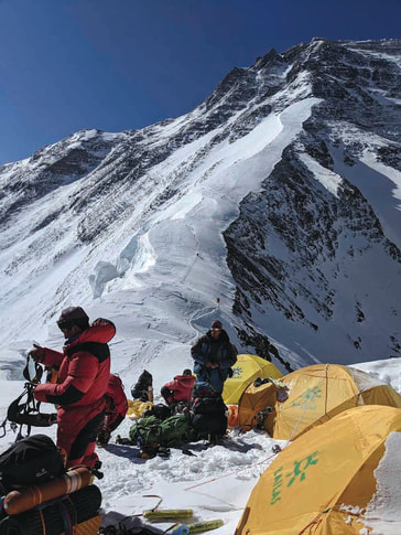 Sherpas preparing for the snow slope climb from Camp 1 to Camp 2.